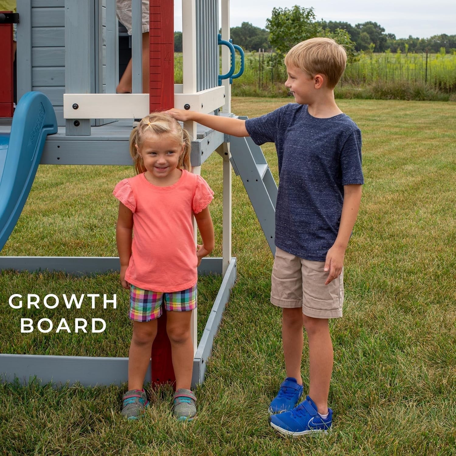 Elevated Cedar Kids Playhouse with Slide Toy Kitchen Growth Chart